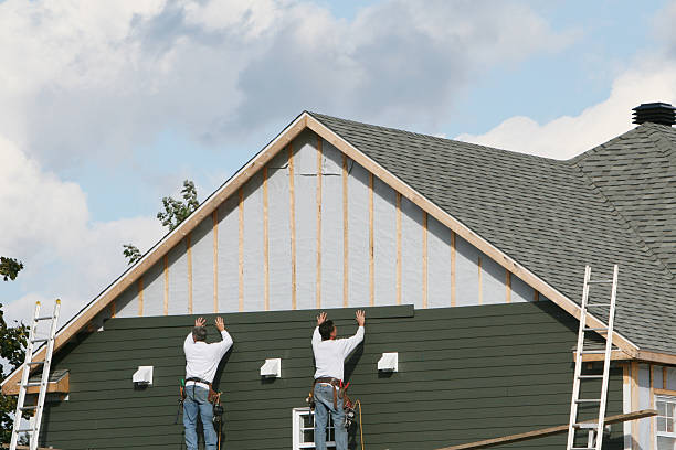 Professional Siding Contractor technician working in Mineola, NY
